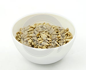 Sunflower seed cores in a white bowl