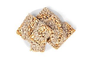 Sunflower seed kozinaki isolated on white. Sweet bars with seeds and caramel.