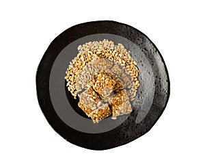 Sunflower Seeds Bar on Black Plate, Energy Snack with Honey, Sun Flower Seed Muesli Dessert