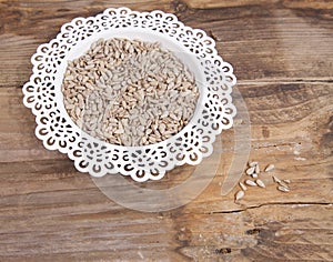 Sunflower seeds in white bowl
