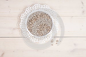 Sunflower seeds in white bowl