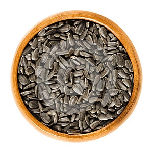 Sunflower seeds in wooden bowl