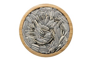 sunflower seeds in wooden bowl isolated top view on white background