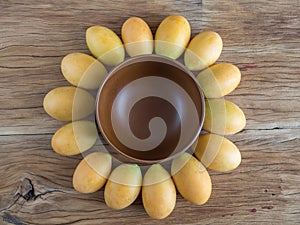 Sunflower shape made from marian plum and wooden bowl