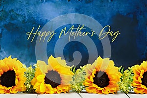 Sunflowers for Mothers Day Against a Blue Painterly Background