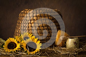 Sunflowers and old beehive