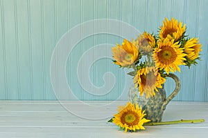 Sunflowers. Summer bouquet in crockery with pastel background