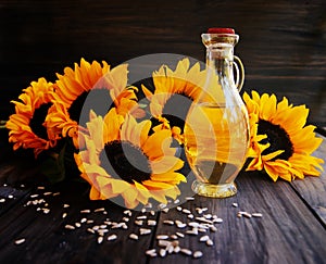 Sunflowers, sunflower seeds and a bottle of oil