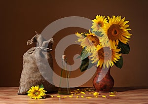 Sunflowers in a vase and a sack of jute