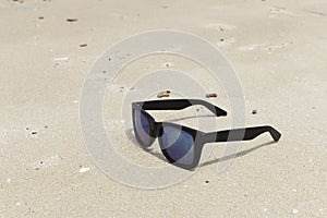 Sunglasses on a beach sand