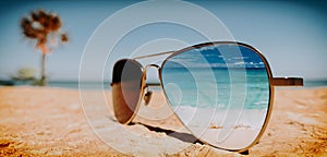 Sunglasses on the beach in summer