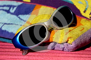 Sunglasses on beach towel
