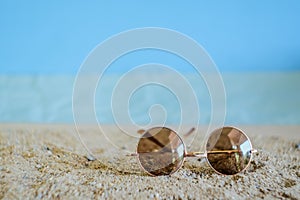 Sunglasses eyeware drop on tropical beach