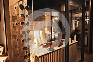 Sunglasses, fashion and retail with eyewear in an empty store after closing after hour for the night. Sale, display and