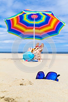 Sunglasses gadgets sunbathers background