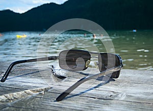 Sunglasses by the lake