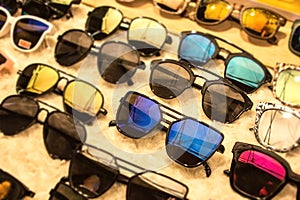 Sunglasses in many dark UV shades for different styles. Shopping for discounts and sales at eyeglass market shop. Get your discoun photo