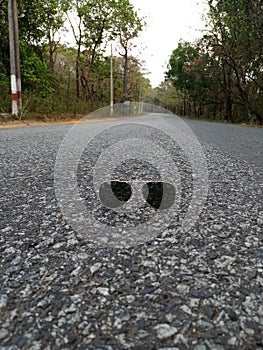 Sunglasses middle of road Beautiful view of nature