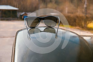 Sunglasses in an old military car