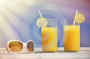 Sunglasses and orange juice