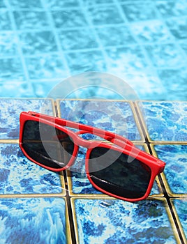 Sunglasses poolside in summer