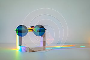 Sunglasses and raibow reflection