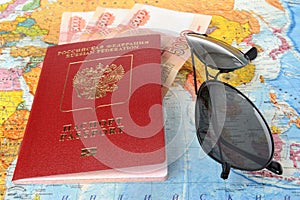 Sunglasses and Russian international passport with money on the