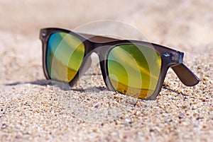 Sunglasses on the sand, close up view, beach