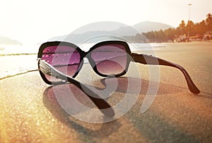 Sunglasses on the sand of Palolem beach photo