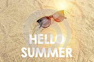 Sunglasses on sand, summer concept