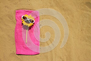 Sunglasses on sandy beach