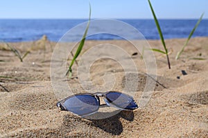 Sunglasses and sea background