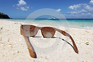 Sunglasses on sea beach