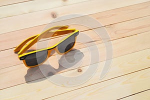 Sunglasses on the table with reflection sky