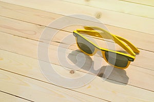 Sunglasses on the table with reflection sky