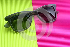 Sunglasses on trendy minimal multicolor background