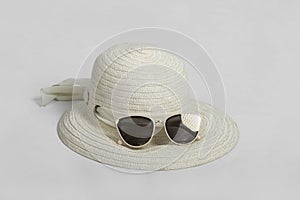 Sunglasses with white straw hat