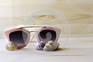 Sunglasses on wood background, holidays on sunny world