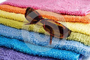 Sunglusses and towel