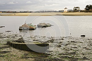 Sunk boat in the low tide