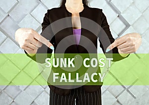 SUNK COST FALLACY phrase on the screen