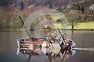 Sunken boat in Loch Lochy - Scotland photo
