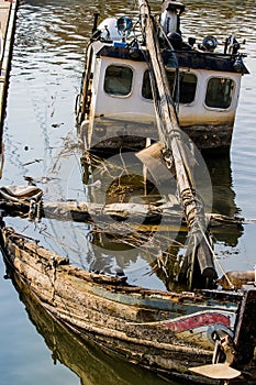 Sunken boat moored up on Polish riverbank