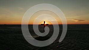 Sunken Cemetery cross in Camiguin island, Philippines.