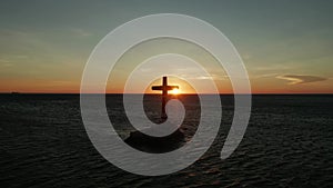 Sunken Cemetery cross in Camiguin island, Philippines.