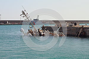 Sunken ship in port. Catania, Sicily, Italy