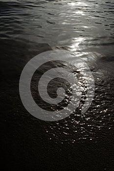 Sunlight brightening dark sea water waves