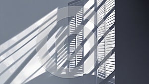Sunlight casting diagonal shadows through window shutters pattern