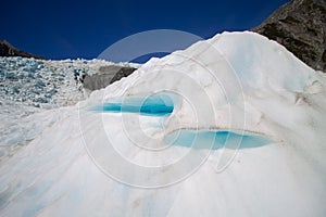 Sunlight from a clean sky shining through ice with a blue neon effect