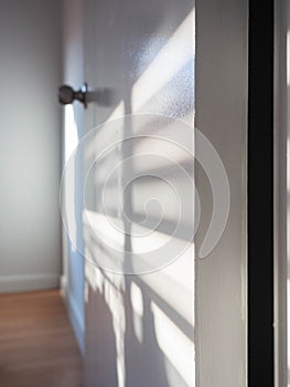 Sunlight,On door and wall,Color white,Shadow on light